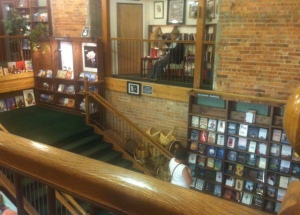 The guy reading is a statue on the landing.